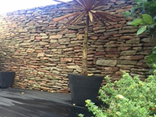 garden decking, dry stone wall, planter